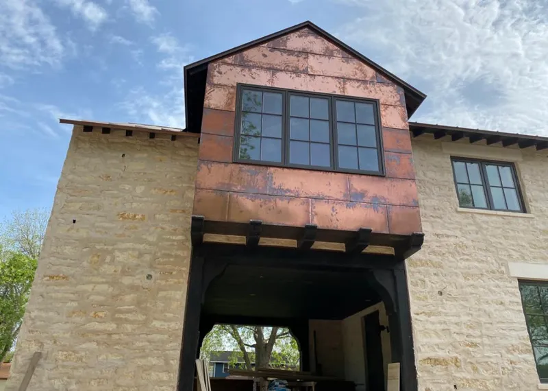 Copper metal panel facade on a stone building for Skylight Installation in Fanwood
